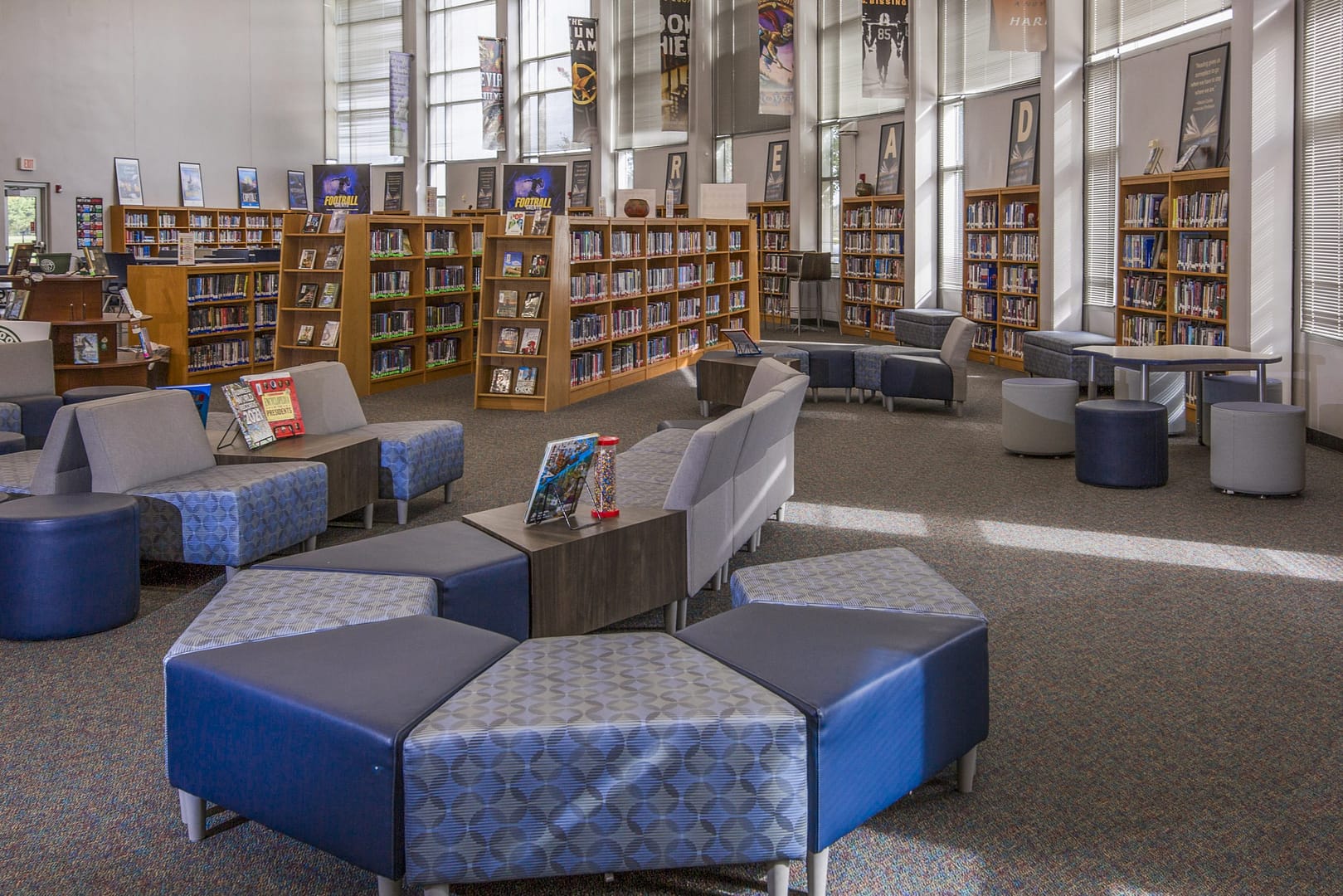 Bookshelves, cushioned chairs, low tables, and big windows in a reading room at Reedy Laurel Elementary, Greenville, SC.
